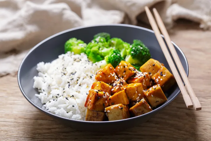 Stir fry dish with chopsticks