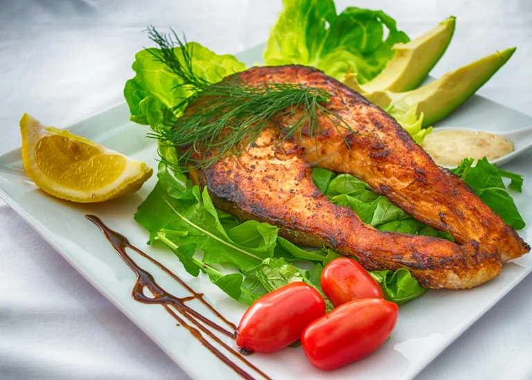 Mediterranean diet dish composed of salmon and salad items