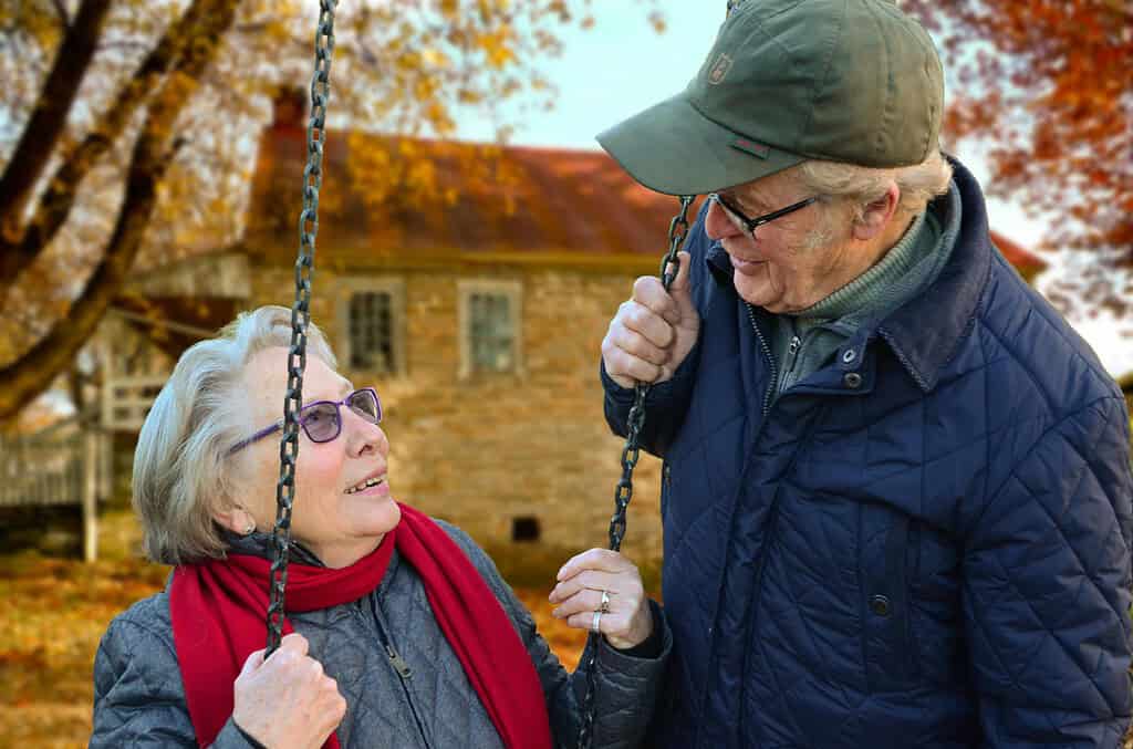 Elderly man and woman talking outside